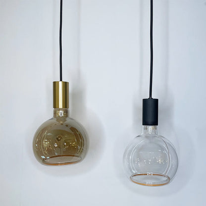 Two pendant lights with glass shades and metal bases on a white background