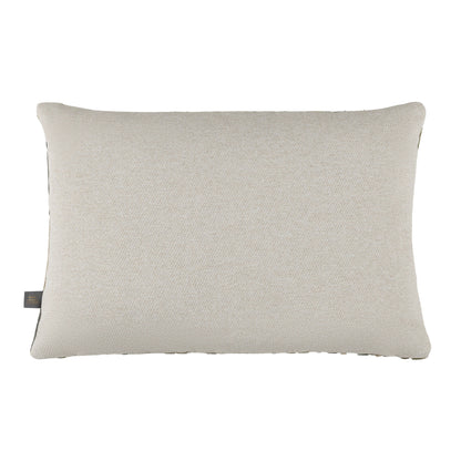 Textured beige pillow on a white background