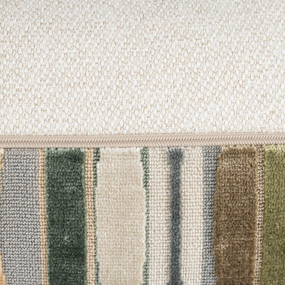 Close-up of a textured rug with a striped pattern featuring green, beige, and brown colors.