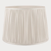 Silver pleated lampshade on a white background