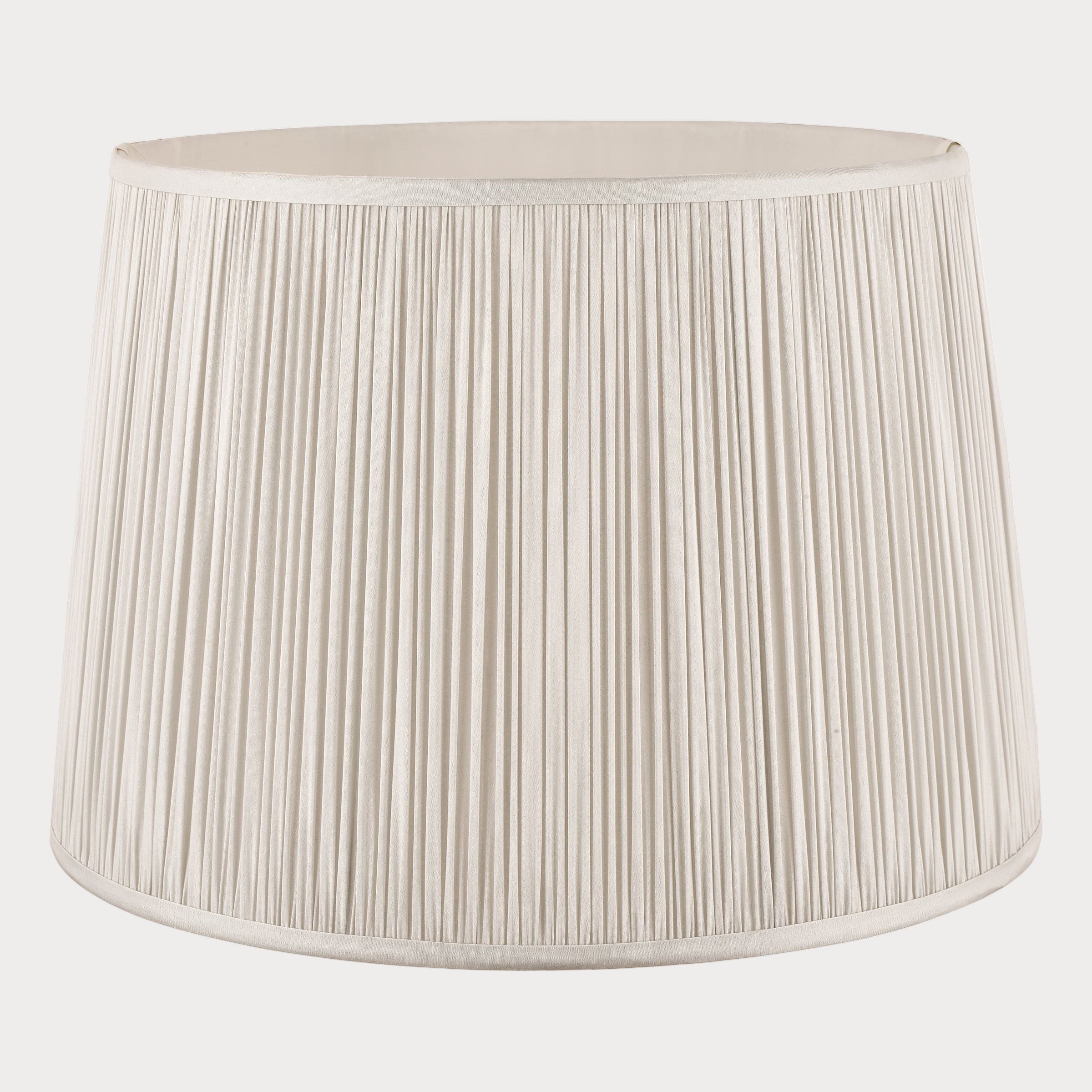 Silver pleated lampshade on a white background