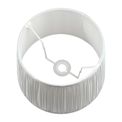 Silver lampshade with a textured base on a white background