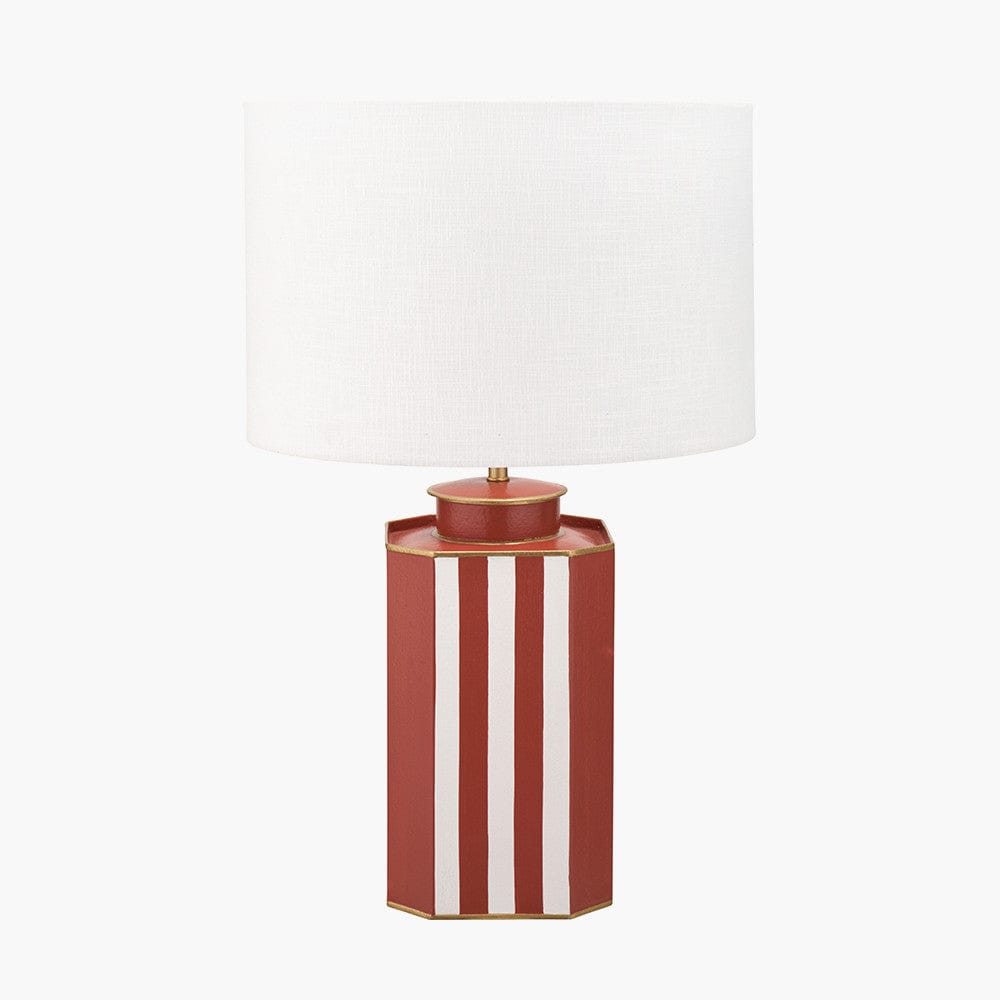 Table lamp with a red and white striped base on a white background