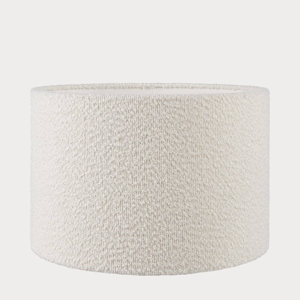 A beige boucle drum lampshade with a textured finish, displayed against a white background.