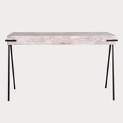 A rectangular console table with a concrete effect top and black angular legs.