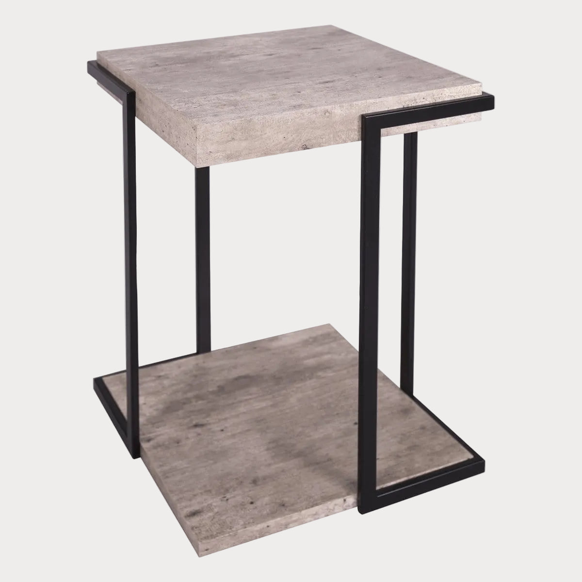 A square side table with a concrete effect top and black angular legs.