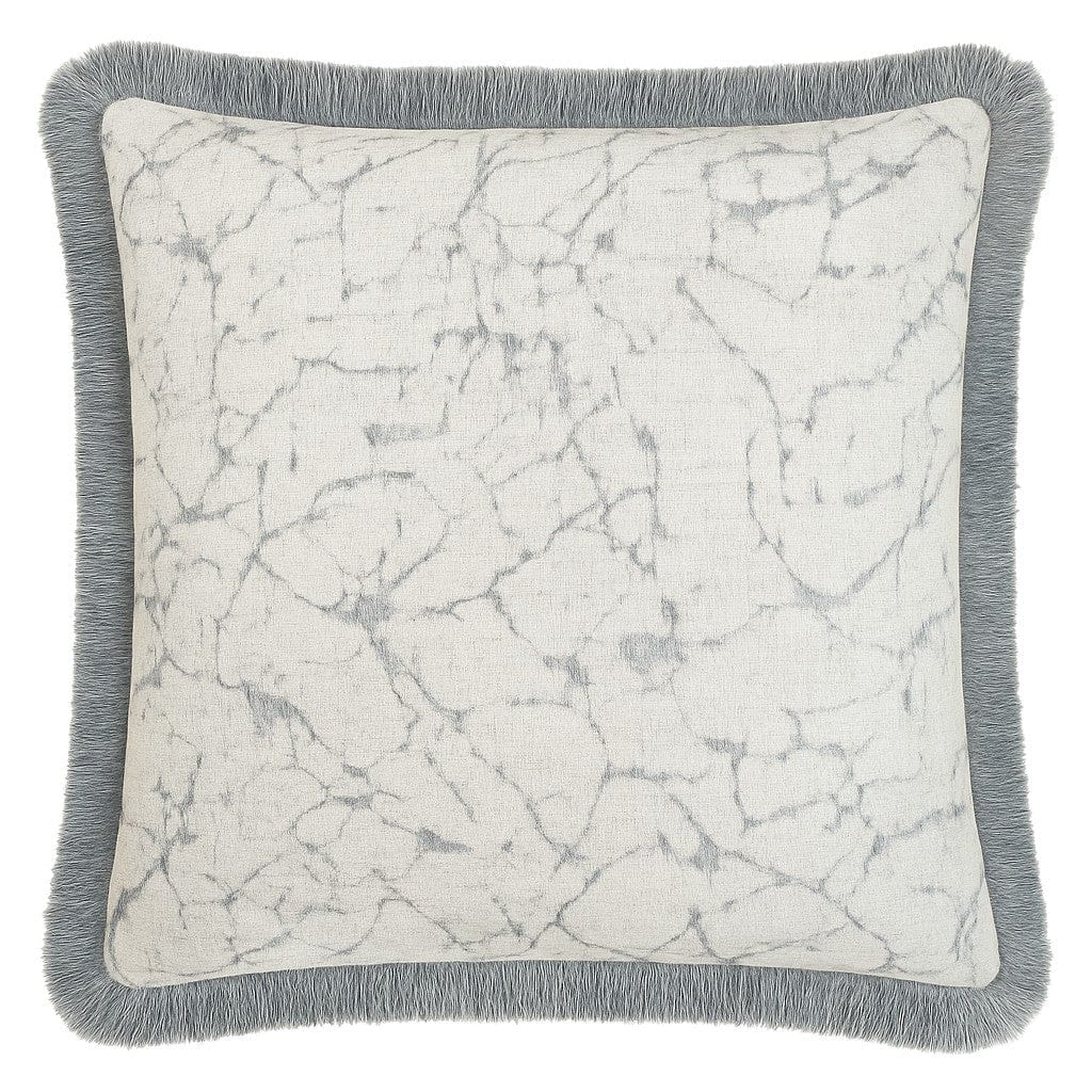 Decorative pillow with marble pattern and gray fringe on a white background