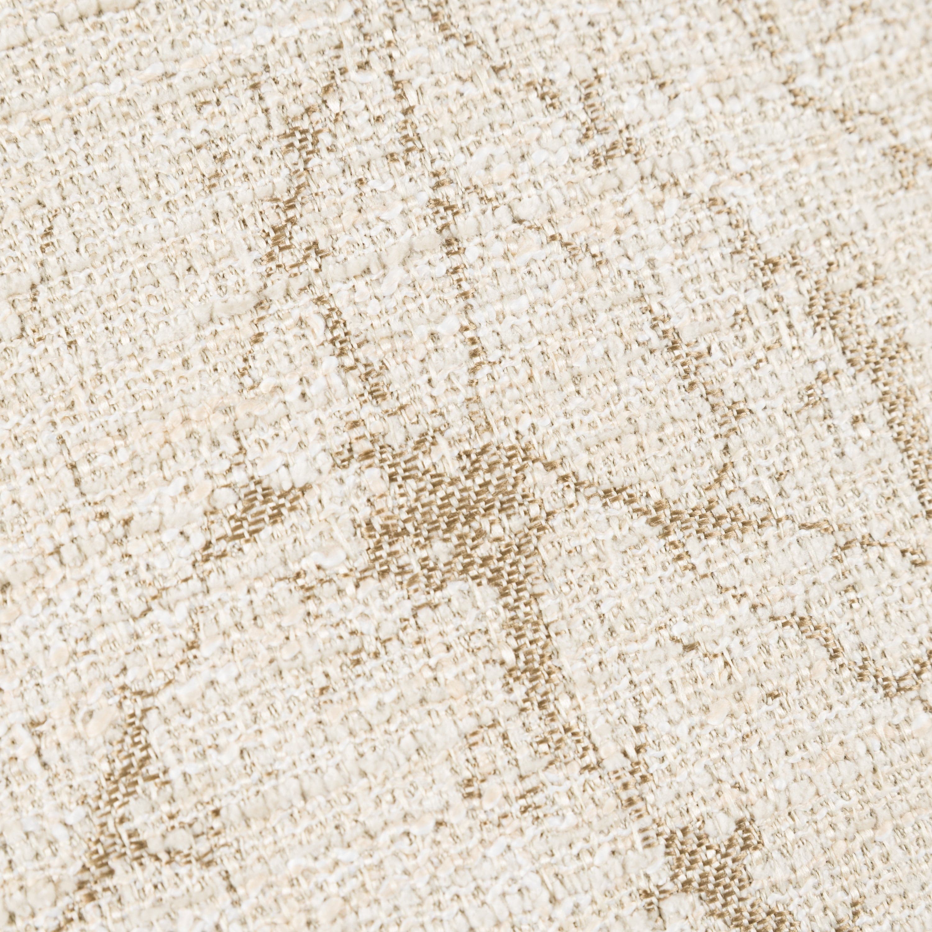 Close-up of a textured beige fabric with a subtle pattern
