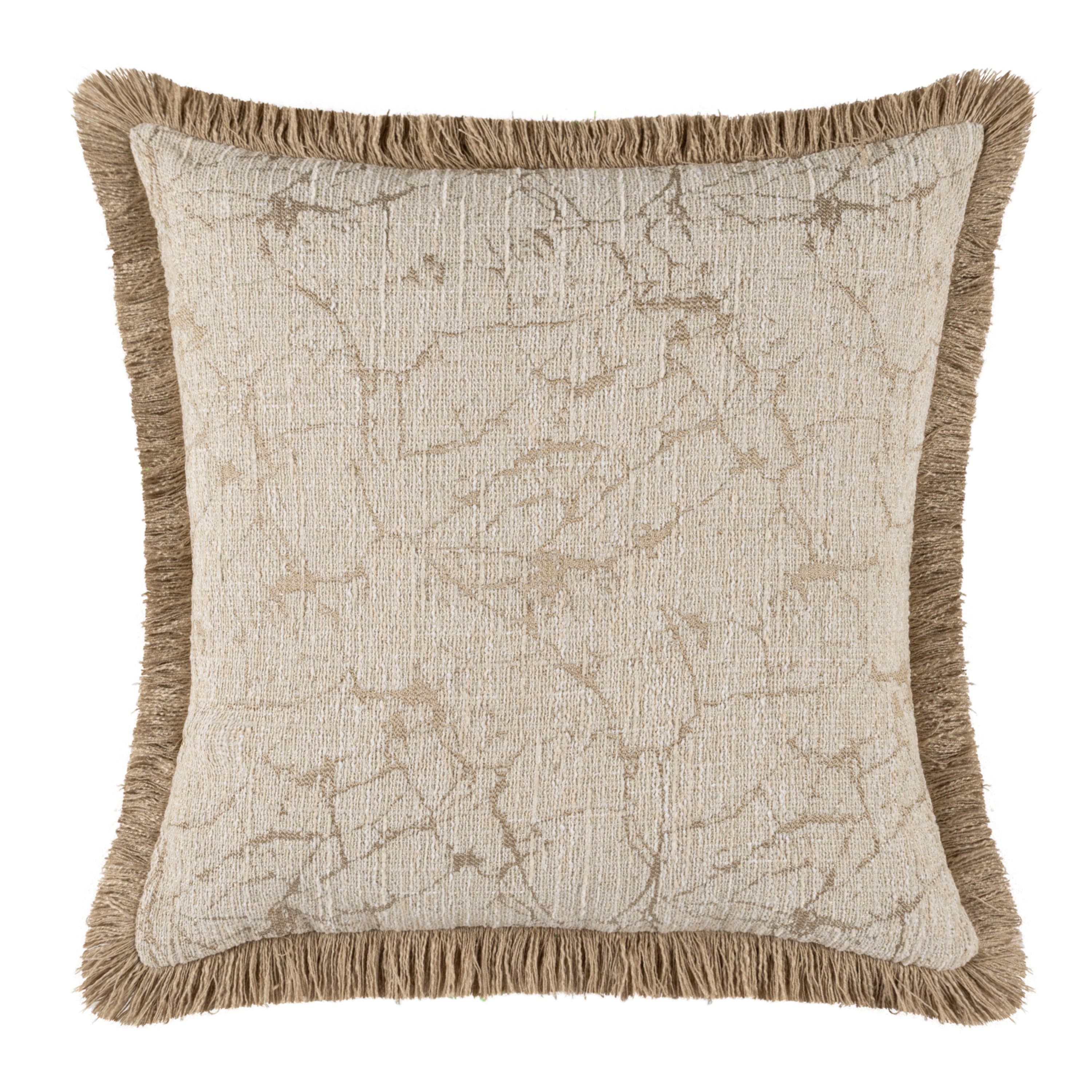Decorative pillow with textured pattern and frayed edges on a white background