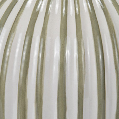 Close-up of a textured surface with alternating light and dark brown stripes.