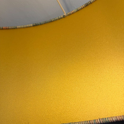 Gold-colored material with a textured surface