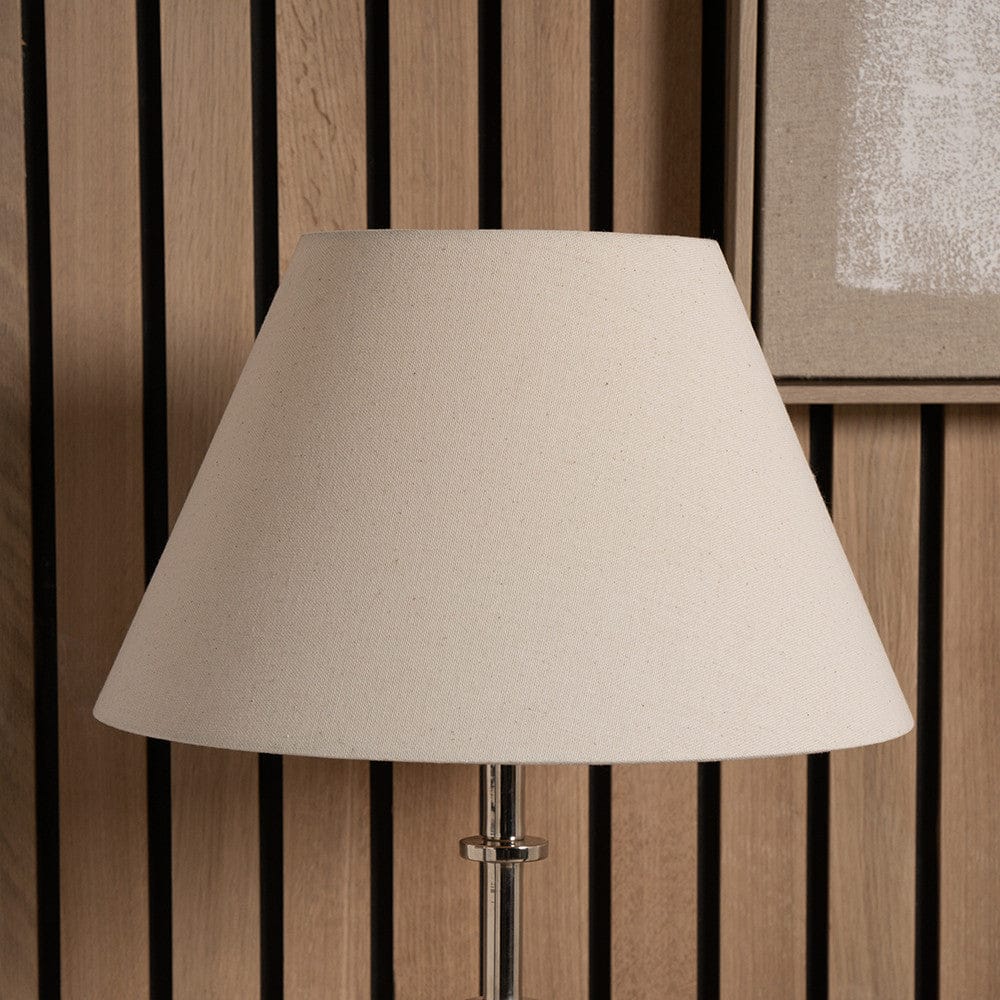 Beige lampshade on a wooden background