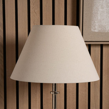 Beige lampshade on a wooden background