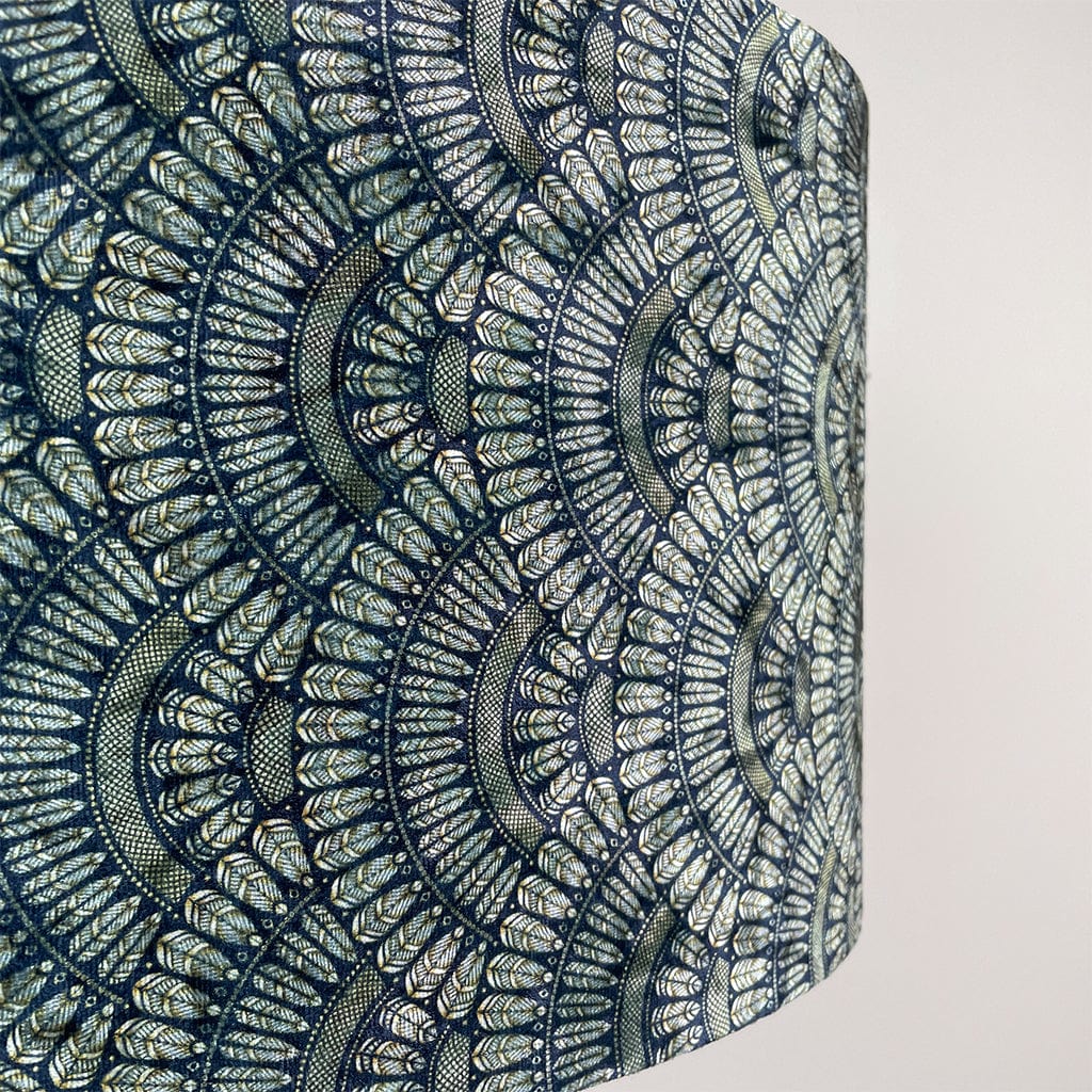 Patterned velvet with blue and gold Art Deco design on a white background