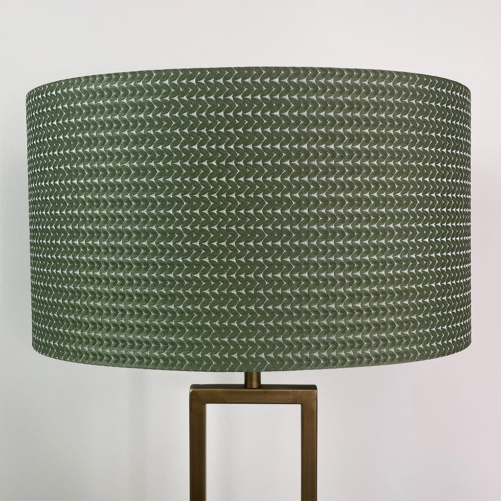Green textured lampshade on a white background