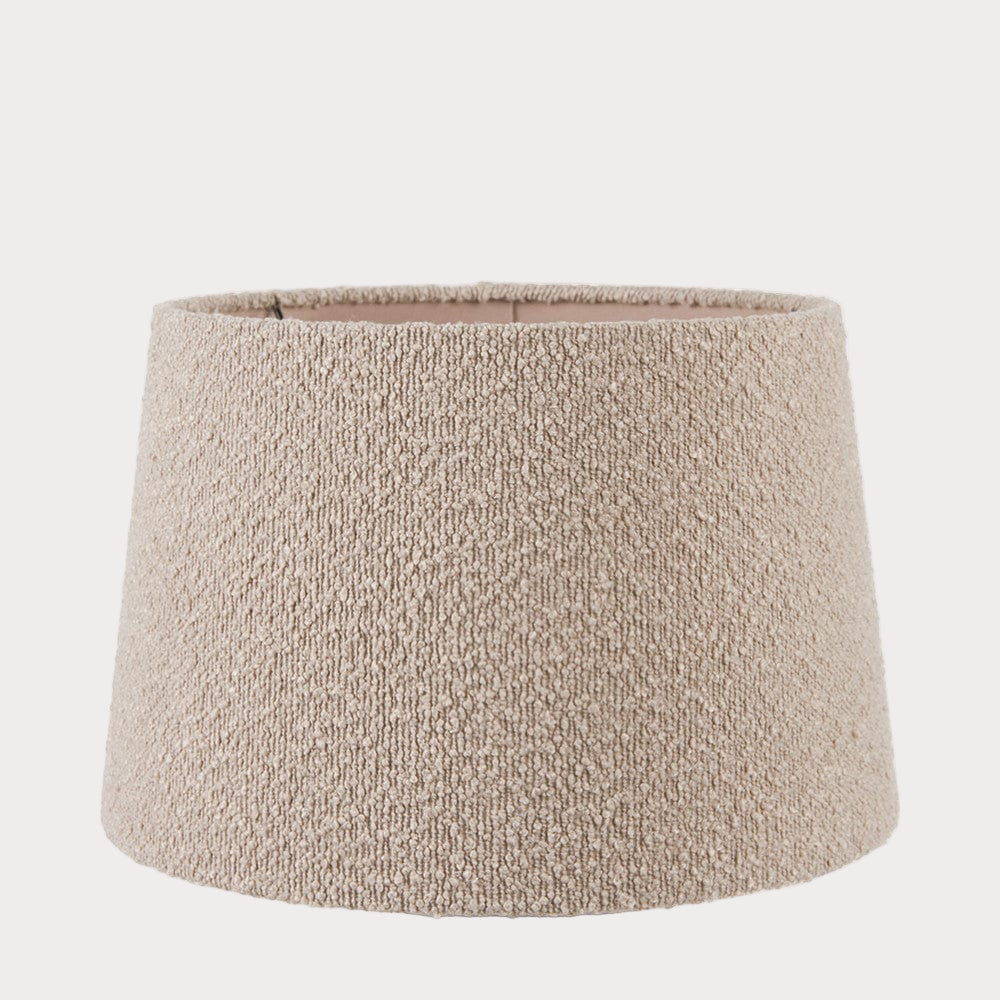 A taupe-colored boucle fabric tapered cylinder lamp shade.