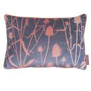 A rectangular cushion with a floral pattern featuring teasel in pink and stone colors on a dark background with orange piping.