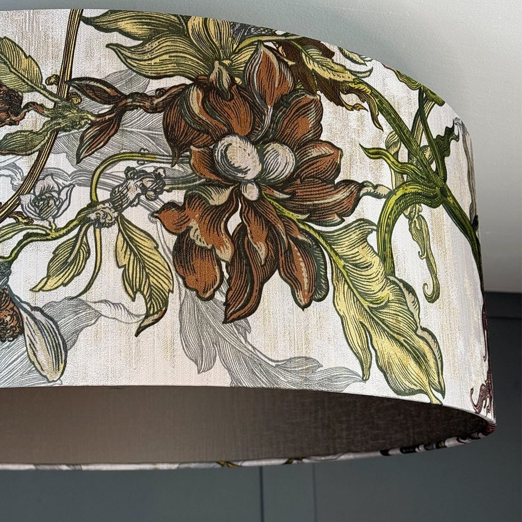 Floral patterned lampshade with green leaves and brown flowers on a white background