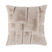 A fluffy light coloured soft cushion with a geometric pattern and a white background