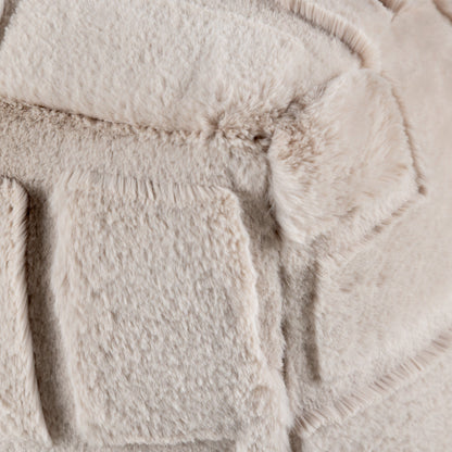 Close-up of a textured beige fabric surface on the cushion seat
