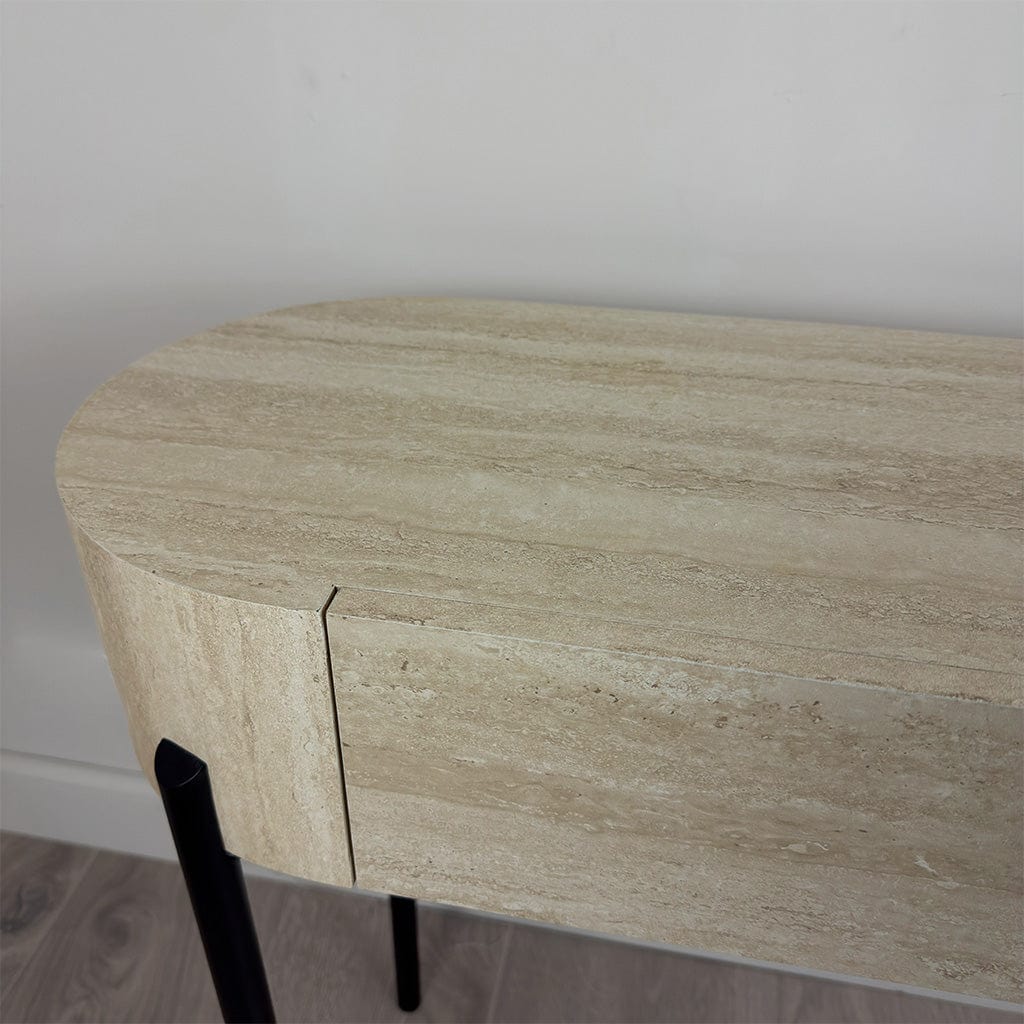 Round wooden table with a light brown finish on a plain background