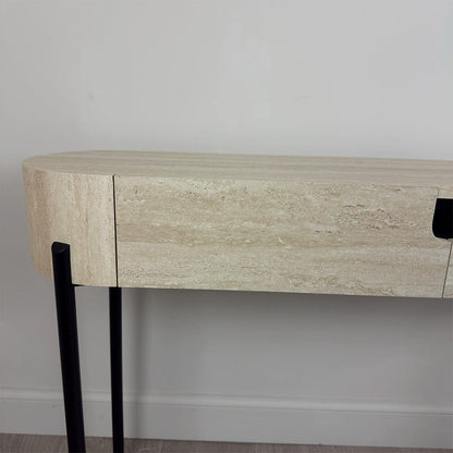 Wooden console table with black legs against a plain wall