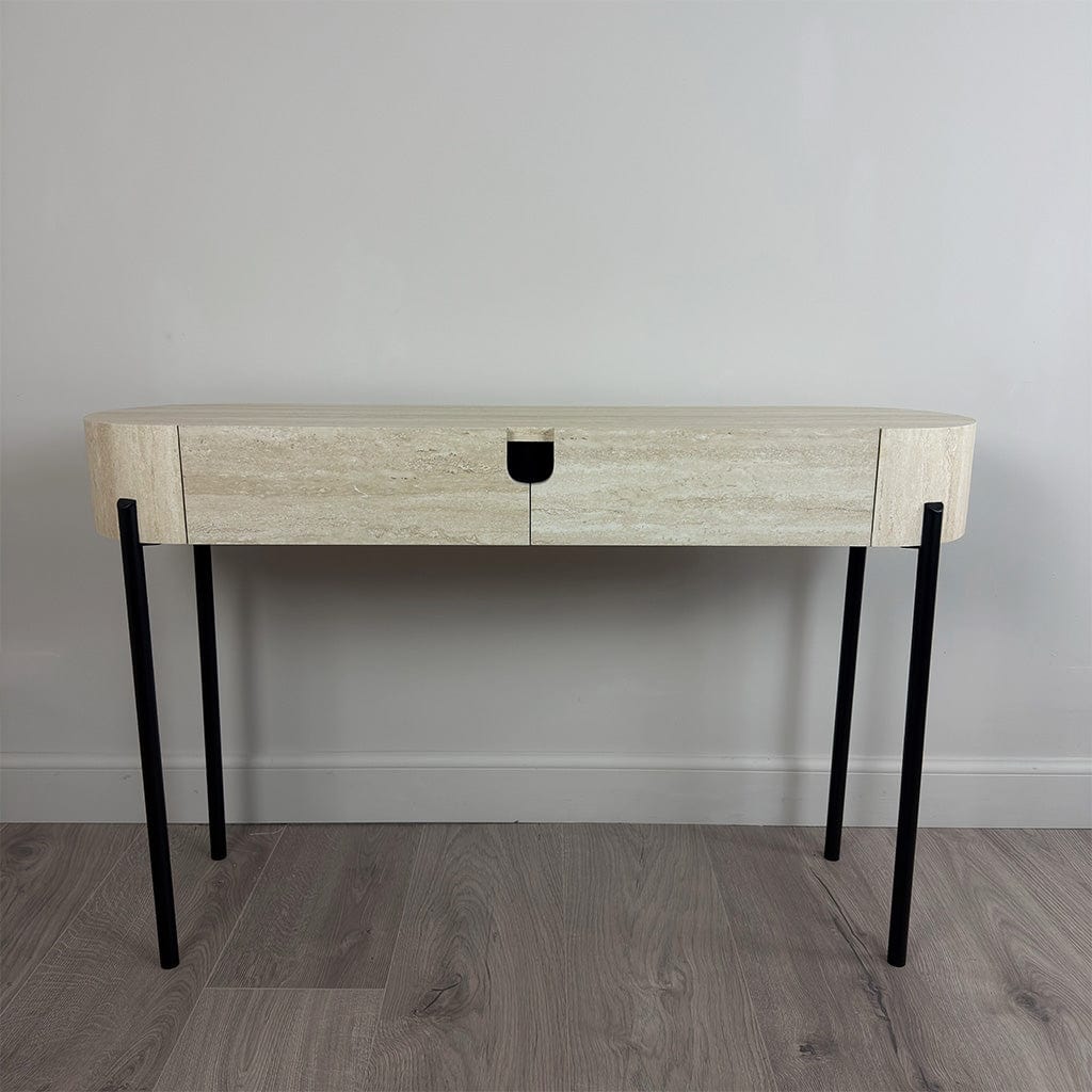 Wooden console table with black legs against a gray wall.