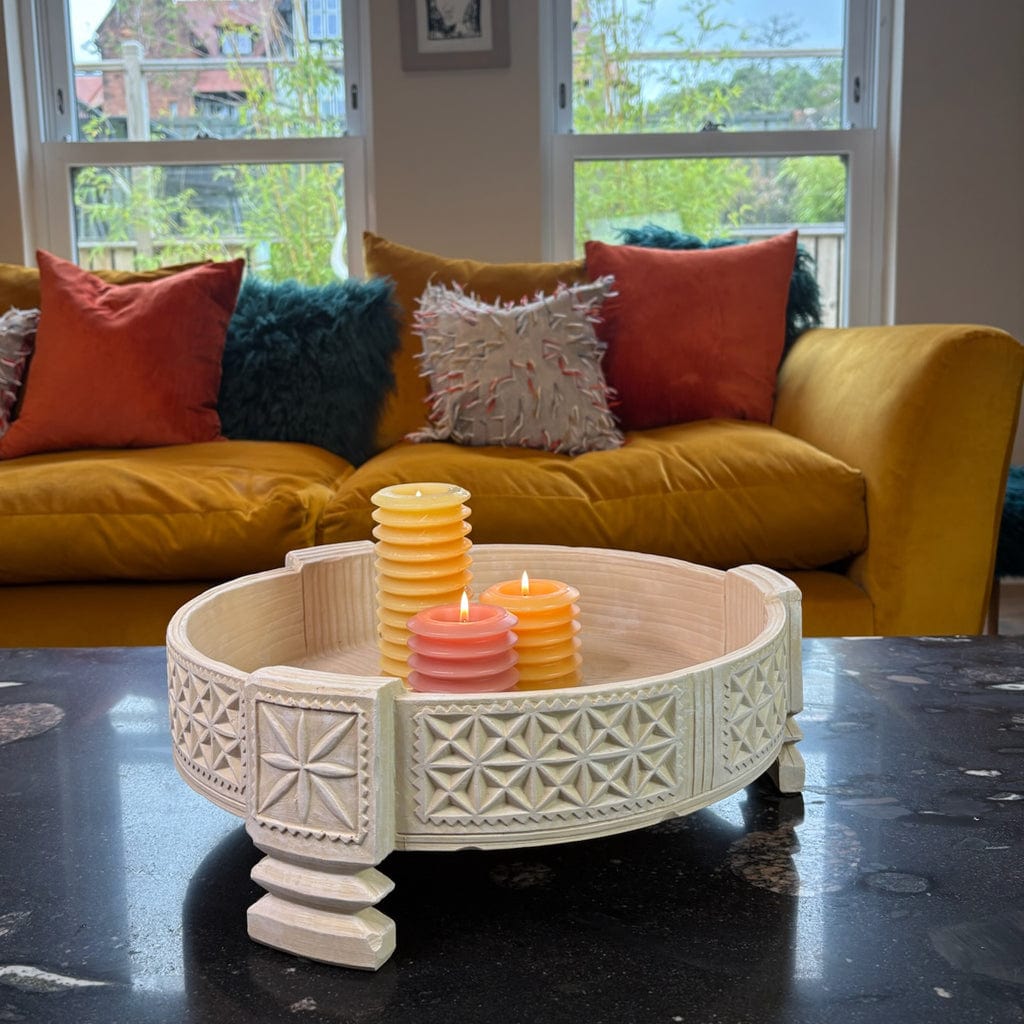 Decorative table with candles in a living room setting