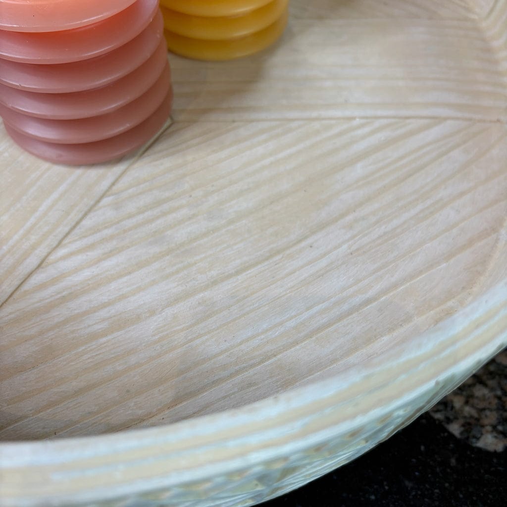 Close-up of a wooden surface with colorful circular objects on top