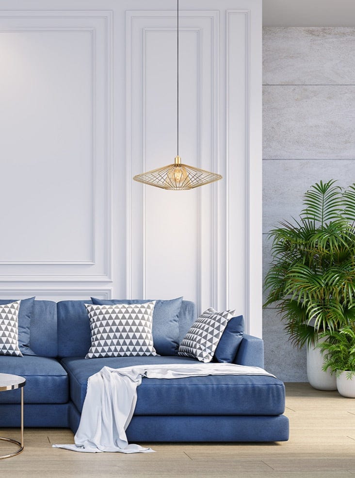 Modern living room with a blue sofa, decorative pillows, and a pendant light.