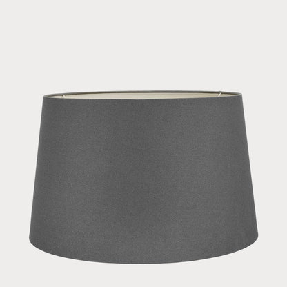 A gray cotton tapered lampshade with a natural finish, displayed on a plain background.