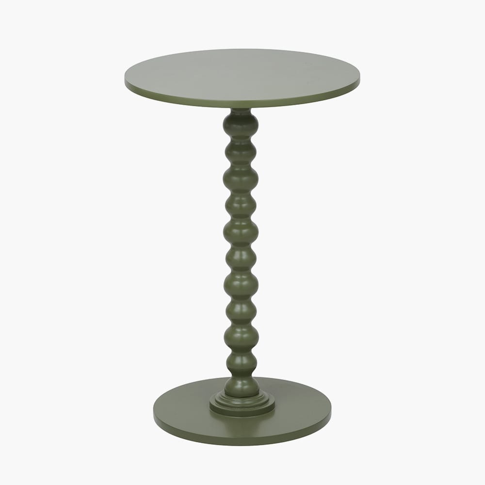 Green round side table with a textured pedestal base on a white background