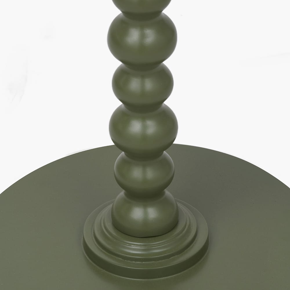 Green textured candle holder on a white background