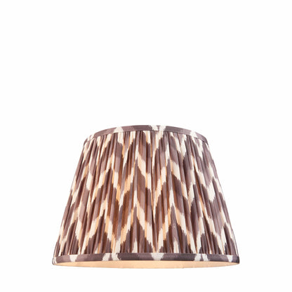 Patterned grey lampshade on a white background