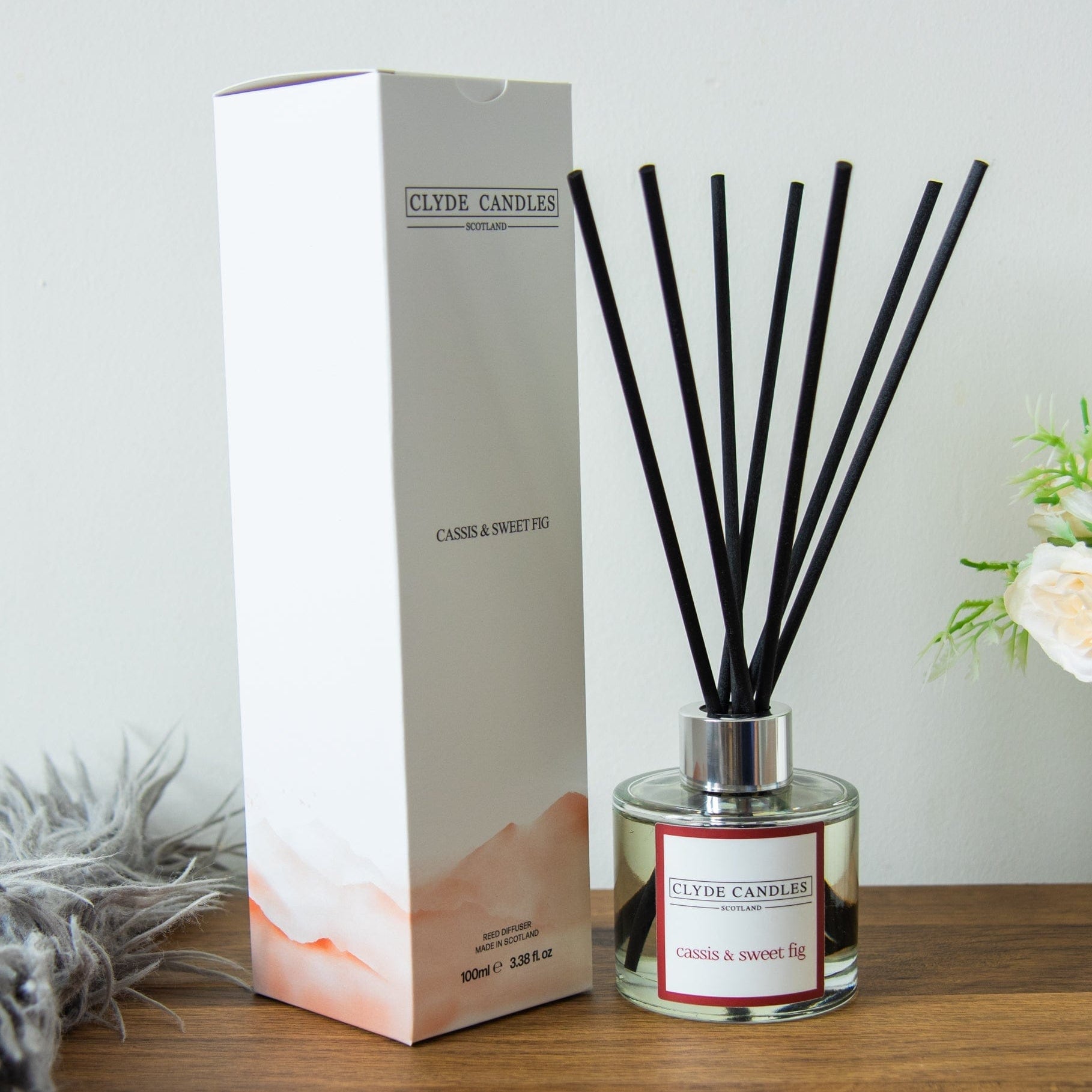 Clyde Candle diffuser with packaging on a wooden surface