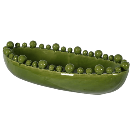 Green ceramic bowl with spherical protrusions on a transparent background