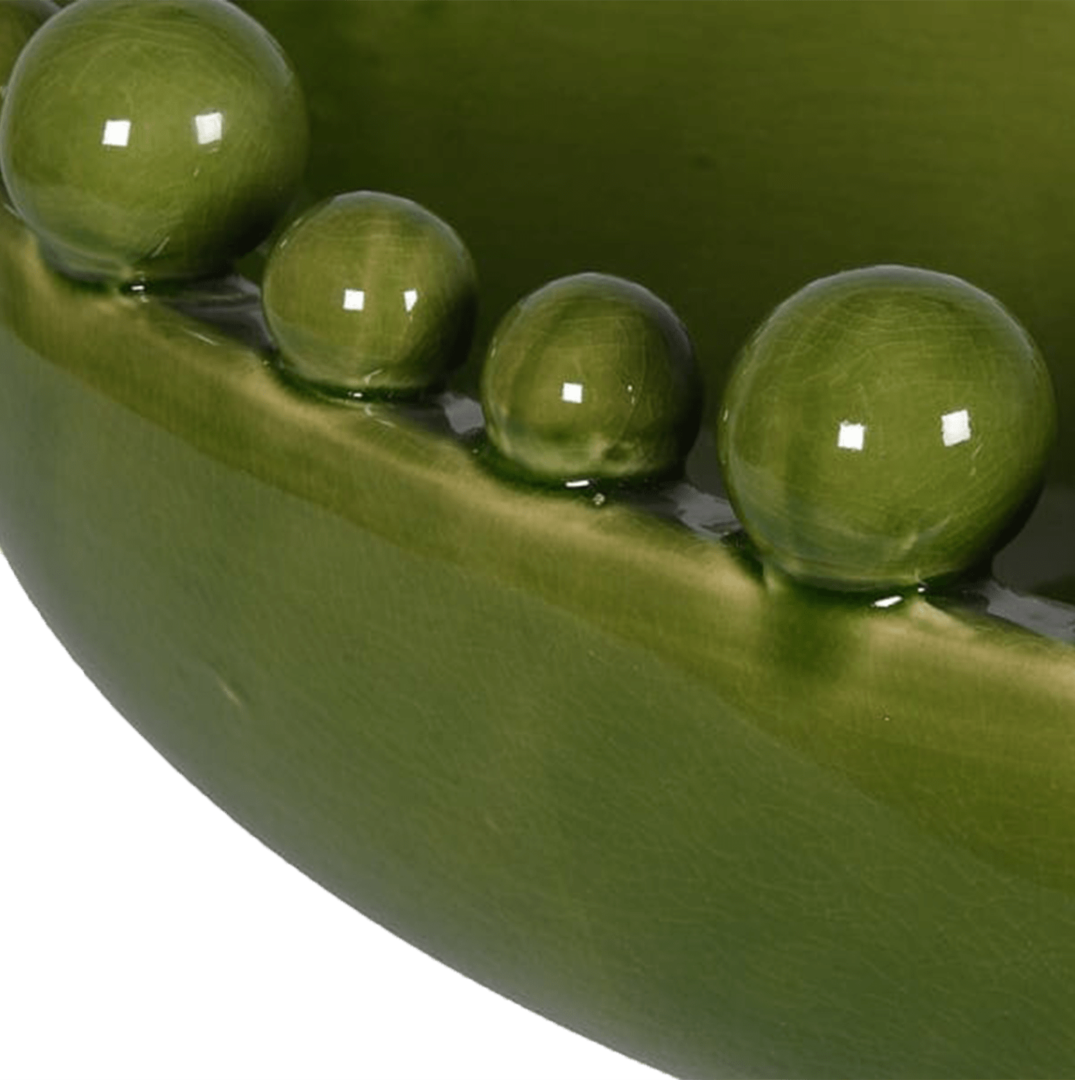 Close-up of green peas in a pod with water droplets on a green background