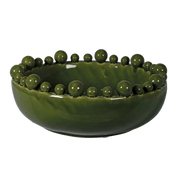 Green ceramic bowl with spherical embellishments on a transparent background