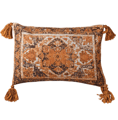 Decorative pillow with intricate morrocan style patterns and tassels on a transparent background