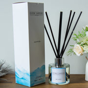 Clyde Candles diffuser with packaging on a wooden surface