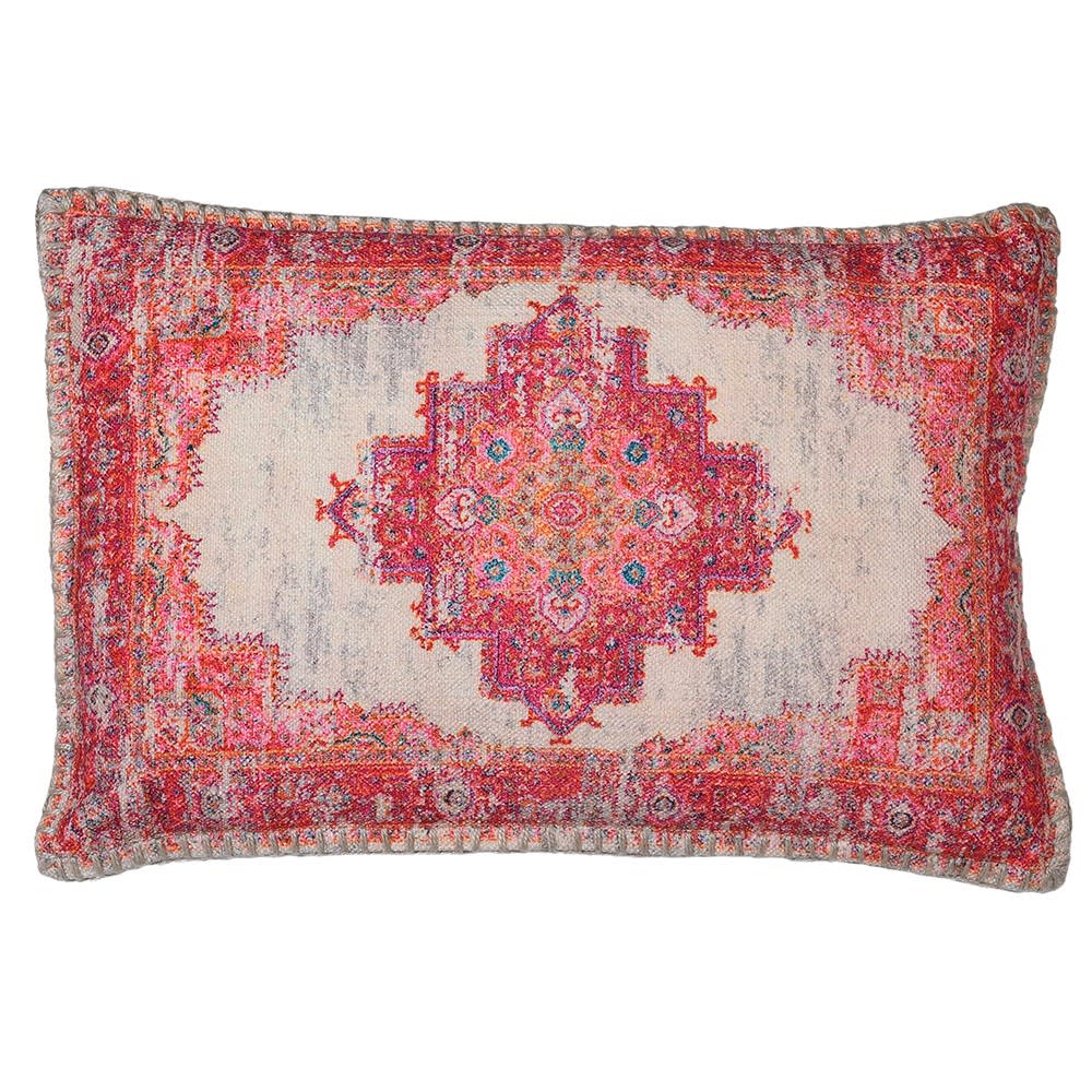 A rectangular cushion with a geometric pattern in red, pink, and orange tones, with a faded and distressed design resembling an Persian rug.