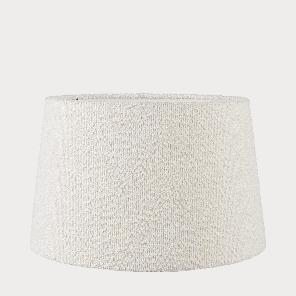 A white-colored boucle fabric tapered lampshade with a visible textured pattern, designed for table or ceiling lamps.