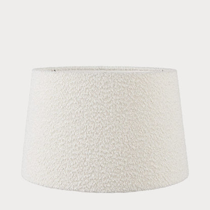 A white-colored boucle fabric tapered lampshade with a visible textured pattern, designed for table or ceiling lamps.
